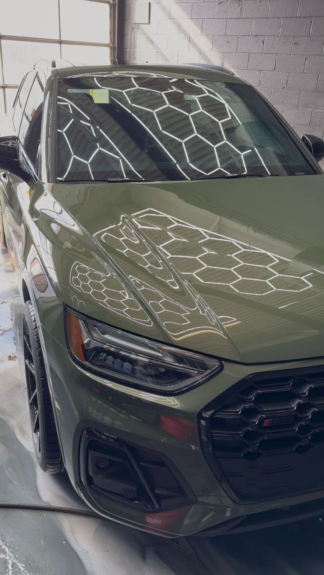 Green Audi photographed inside the detailing studio