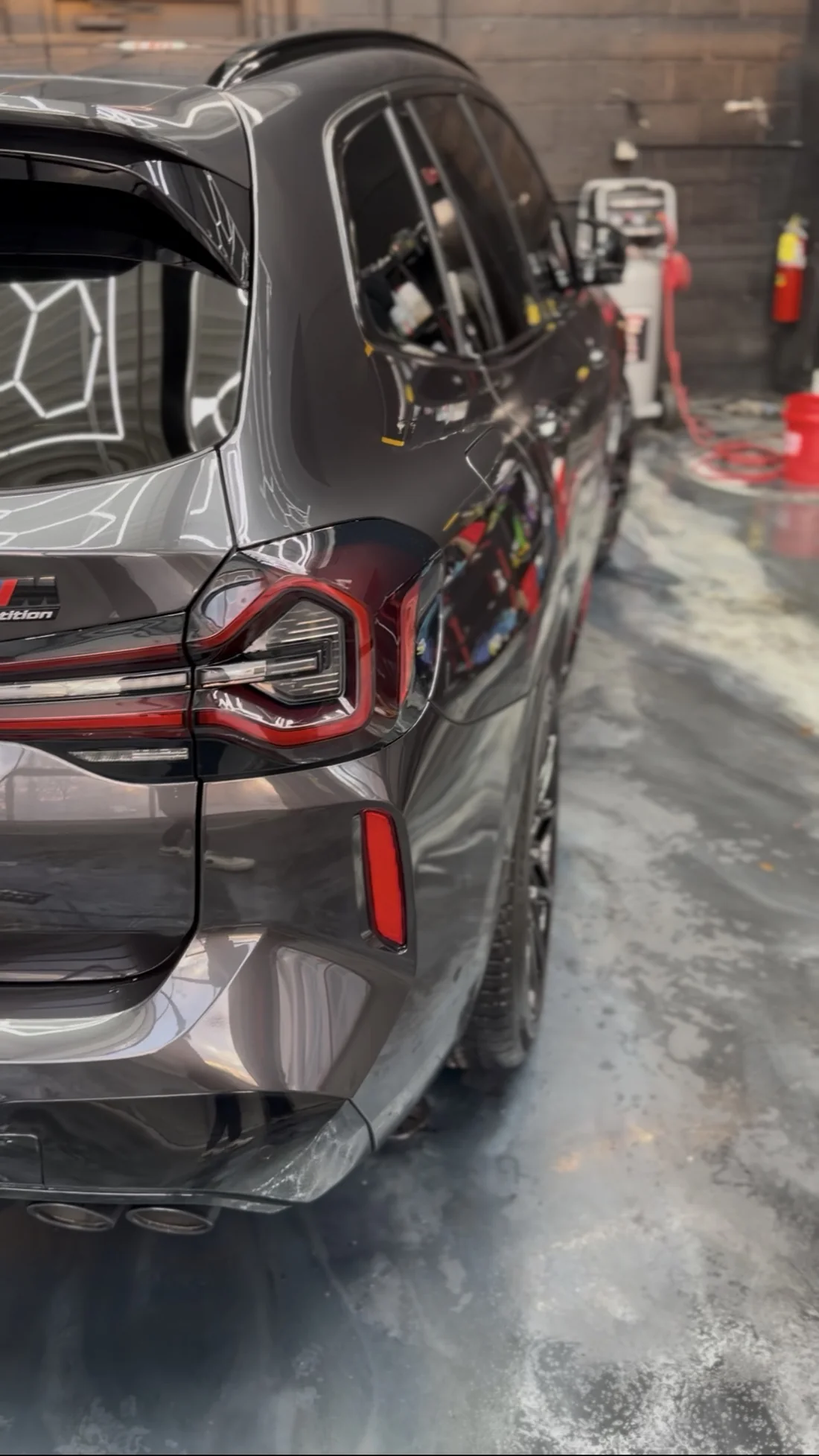 Gray SUV photographed inside the detailing studio