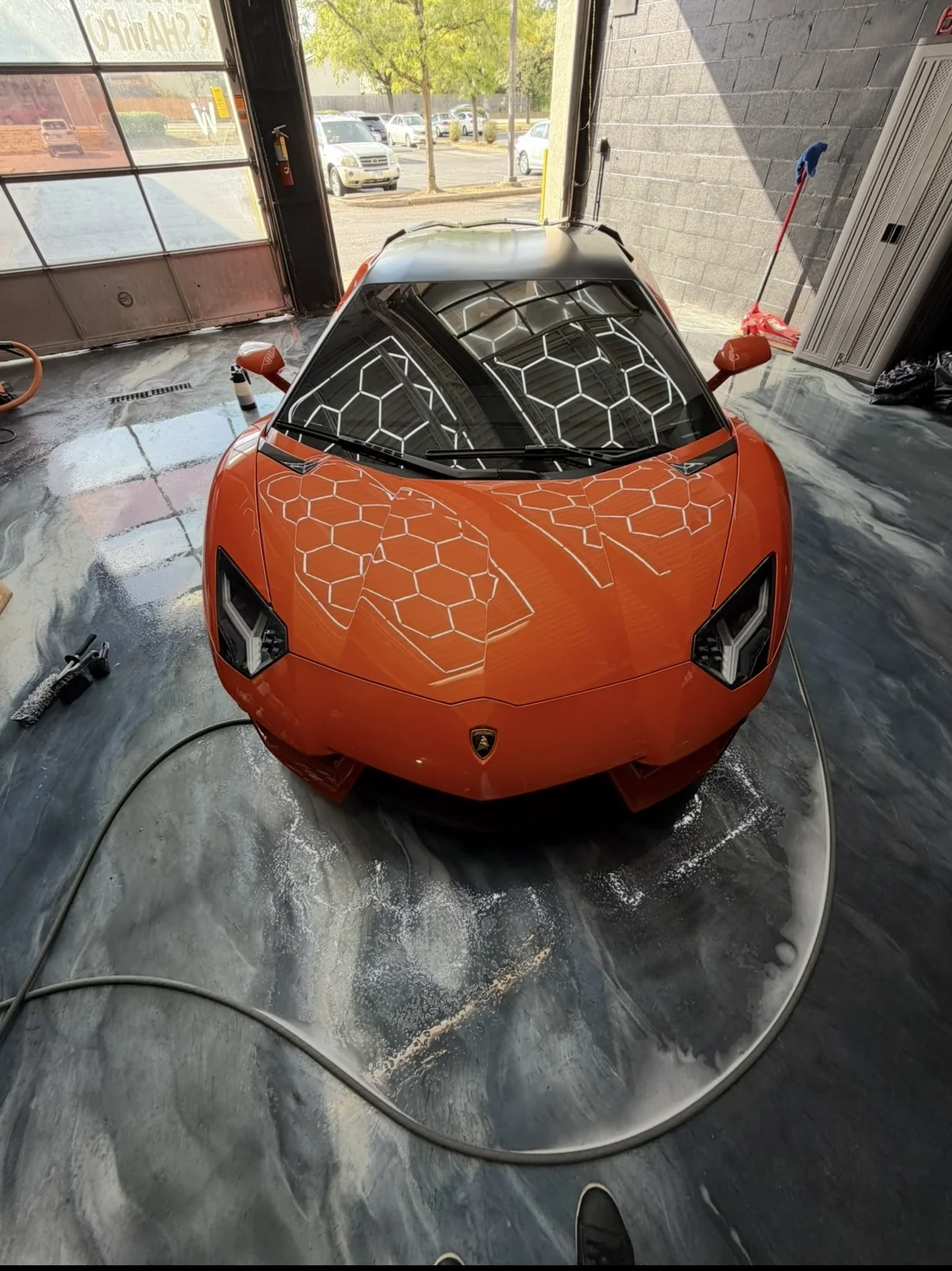 Orange Lamborghini photographed at the Hersheys Detailing studio